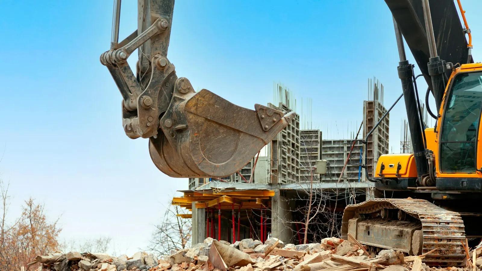 Excavator bucket during demolition and site preparation for a new build