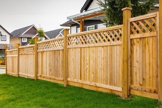 Finished cedar privacy fence with lattice top and matching gate