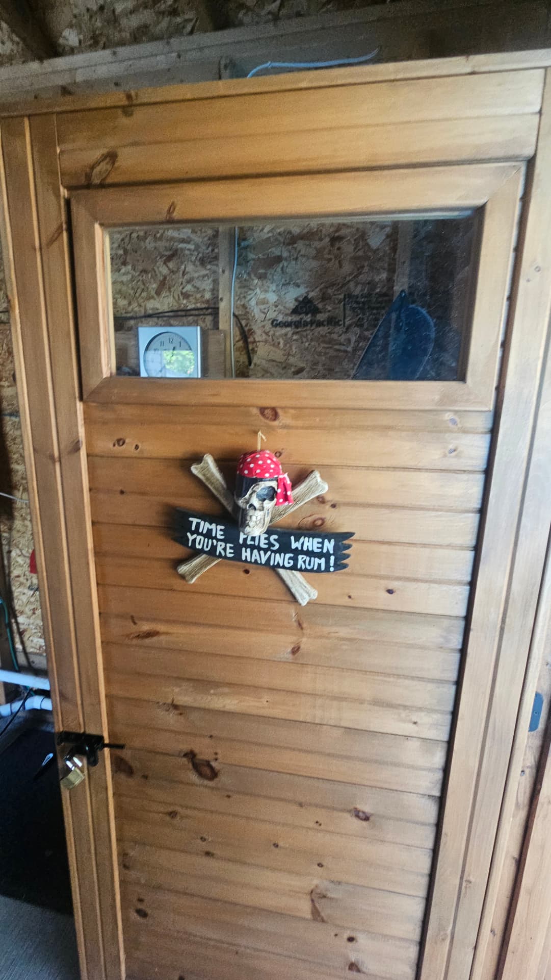 Custom cedar door on a poolside cabana storage room