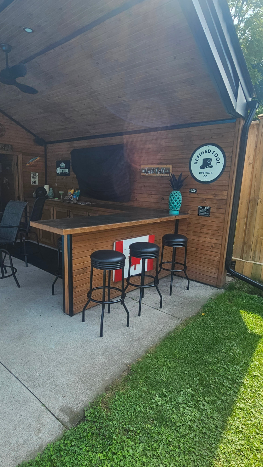 Cedar-lined covered bar and seating area in the custom Twin Lakes four season room addition