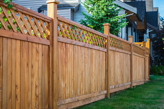 Cedar privacy fence with lattice top along a residential property line